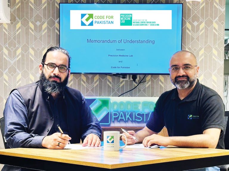 Shaji and Dr Faisal sign an MoU at the CfP Islamabad office in 2023. Photo credit: Shaji Ahmed
